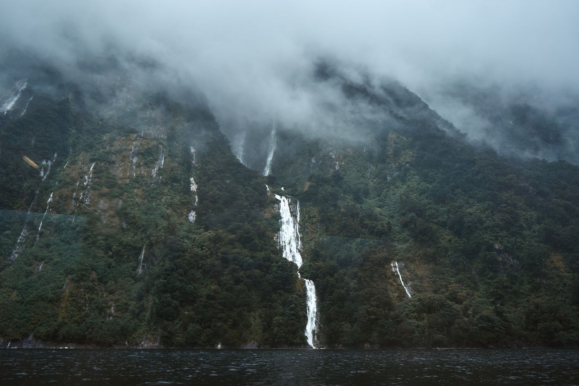 Fiordland misty peaks in Milford Sound